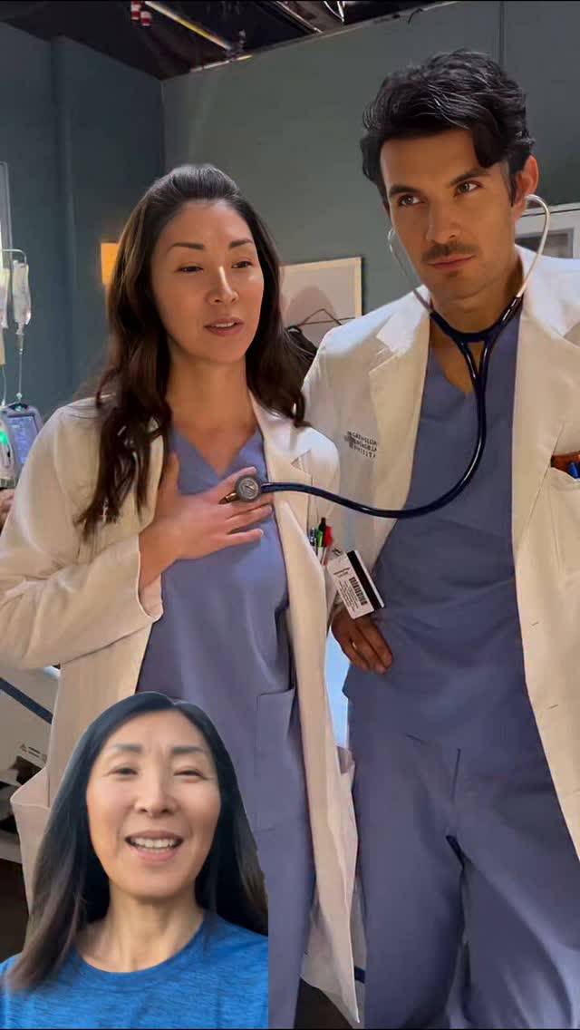 The cover image shows two doctors in a medical setting, with the overlayed image of a woman smiling. The two professional figures, a man and a woman, are dressed in blue scrubs and white lab coats. The woman on the left is holding a stethoscope to her chest, looking towards the right. The man on the right is looking to the left with the stethoscope around his neck. At the bottom, there is an inset image of a smiling woman in a blue short-sleeve shirt.