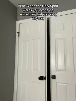 The image shows a pair of white, paneled doors slightly ajar against a gray wall. Text overlayed on the image reads 'POV: when the Holy Spirit warns you not to do something but you do it anyway'.