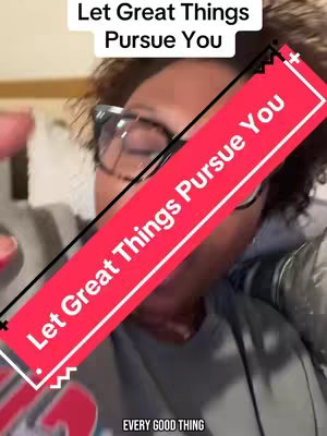 A selfie-style video cover image shows a person wearing glasses, facing the camera. A diagonal red banner with white text overlay stating "Let Great Things Pursue You" crosses the image. The background is blurred.