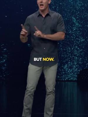 The image shows a man in a dark shirt and light pants standing in front of a blurred background. Text in a yellow box says 'BUT NOW.'
