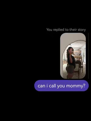 A vertical image against a black background. On the left side, there's a large black empty space. On the right side, a text bubble appears at the bottom of the frame containing the question, 'can i call you mommy?'Above that is a screenshot of a woman posing from the back in the mirror. The woman has dark hair.