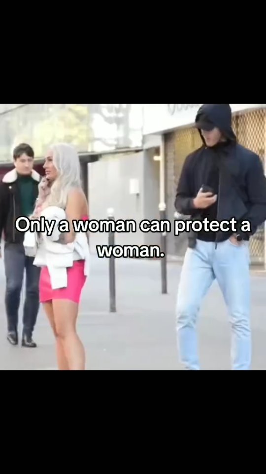 The cover image shows three people standing on a city street. A woman in a pink dress and white jacket is talking on the phone, with a man in a black jacket and hoodie looking at the phone behind her. The hook text is overlaid on the image.
