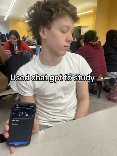 A young man with messy brown hair sits in what appears to be a cafeteria, holding a phone displaying a study app. The app screen shows the percentage '11%' and the word 'MIDTERM'. The man's eyes are closed as if he is deep in thought.