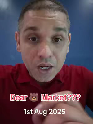 A selfie-style shot featuring a man speaking directly to the camera. He is positioned in front of a solid blue background. The man is wearing a red short-sleeved shirt. Overlayed text at the bottom of the image reads: "Bear Market???", followed by a bear emoji, and then "1st Aug 2025".