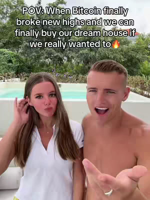 A selfie-style shot featuring a young couple in front of a swimming pool and lush green foliage. The man is on the right, shirtless with a surprised expression and pointing his finger. The woman is on the left, touching her hair with a playful facial expression. Text overlay at the top reads a POV statement.