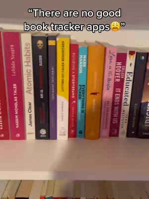 A shelf filled with books is the central focus. The spines of the books are visible, displaying titles and author names in various colors. Overhead, a white shelf serves as a backdrop, while a text overlay stating 'There are no good book tracker apps' is at the top.
