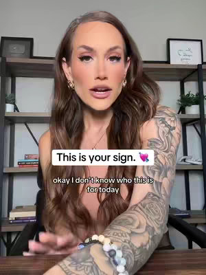 A woman with long brown hair is centered in the frame, with a professional background consisting of shelves and items. The primary focus is on her face and upper body, where the text is overlayed. The image has an overall warm and soft tone, likely due to lighting and makeup.