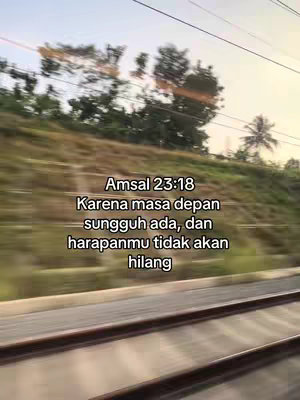 The image, taken from a moving vehicle like a train, displays a blurred landscape with a focus on verdant hills and trees. Parallel tracks line the foreground, reinforcing the motion. Text overlays, in a white font, provide inspirational messages, and references to biblical scriptures within the composition.