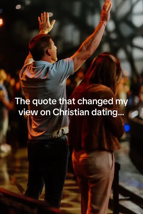 The cover image shows a man with his arms raised upwards with his hands open, as if he is praising something. A woman stands next to him in the background. The image has a warm, low-light ambiance, suggesting a setting with spiritual significance. The framing focuses on the man from the back, emphasizing his uplifted arms. Overlaid text in white contrasts against the darker background.