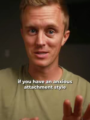 A medium shot shows a man with light skin and blonde hair looking directly at the camera. He is wearing a green shirt. The background is a neutral, slightly blurred space.