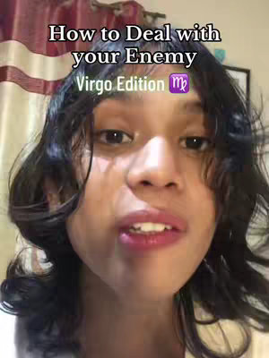 A young woman with dark, curly hair looks directly at the camera with a slight smile. Overlayed text reads, 'How to Deal with your Enemy Virgo Edition' with a Virgo symbol.