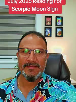 A man with glasses and a slight smile is the main focus. He is wearing a colorful shirt. The background has a window with blinds and some framed pictures. Text overlay says 'July 2025 Reading For Scorpio Moon Sign.'
