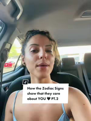 A woman is sitting in the front seat of a car, looking towards the camera and speaking. A white box with the text "How the Zodiac Signs show that they care about YOU 🖤 PT.2" is overlaid on the bottom portion of the image. The background shows the interior of the car and the outdoors.