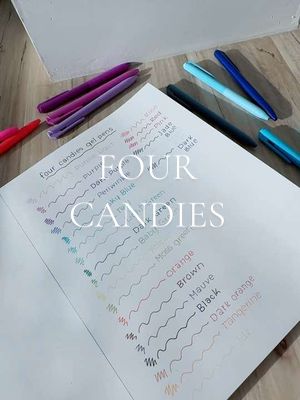 A top-down shot of a notebook opened to a page displaying gel pen swatches. The swatches are arranged in rows with handwritten color names next to them. Gel pens of various colors and shades are laid around the notebook. The text overlay reads 'FOUR CANDIES' in large, stylized font.
