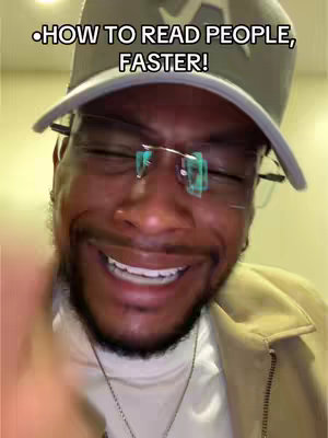 A selfie-style video featuring a man with glasses and a cap, smiling widely. The background is blurred, and the focus is on his face and the text overlay.