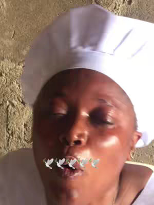 The cover image shows a close-up of a person's face, with their eyes closed and mouth slightly open.. The person appears to be wearing a white chef's hat. There are 3D animated dove graphics around their mouth. The background shows a rough wall texture.