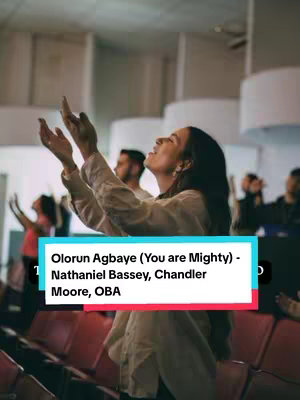 The cover image shows a woman with her arms raised in worship in a church setting. The woman is in the center of the frame, and other people are visible behind her, also with their hands raised. The image is well-lit, and the color palette is warm, contributing to a reverent mood. Descriptive text is overlaid at the bottom