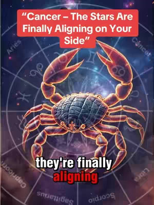 A visually complex image with a deep blue/purple background featuring a circular zodiac design in the background. Overlayed in the center is a detailed crab illustration, representing the Cancer zodiac sign, glowing with orange and yellow highlights. A red banner at the top says, "Cancer – The Stars Are Finally Aligning on Your Side." At the bottom, a text overlay reads "they're finally aligning," in all small letters. The image uses a combination of deep blues, reds, and oranges, which creates a mystical atmosphere.