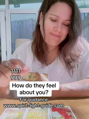 A woman with long brown hair sits at a table with tarot cards, engaging with them with a gentle smile. Overlayed text asks about feelings and provides a website for guidance, with the numbers  1111 and 999 displayed above the text overlay. The overall tone is soft and inviting, with natural light and a serene atmosphere.