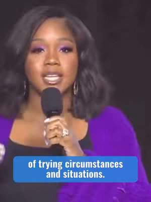 The cover image features a woman, likely the creator, speaking into a microphone. She is dressed in a purple wrap top and a black shirt underneath with purple eye makeup, and the background is in the dark. Text overlayed on the screen reads something related to "trying circumstances".