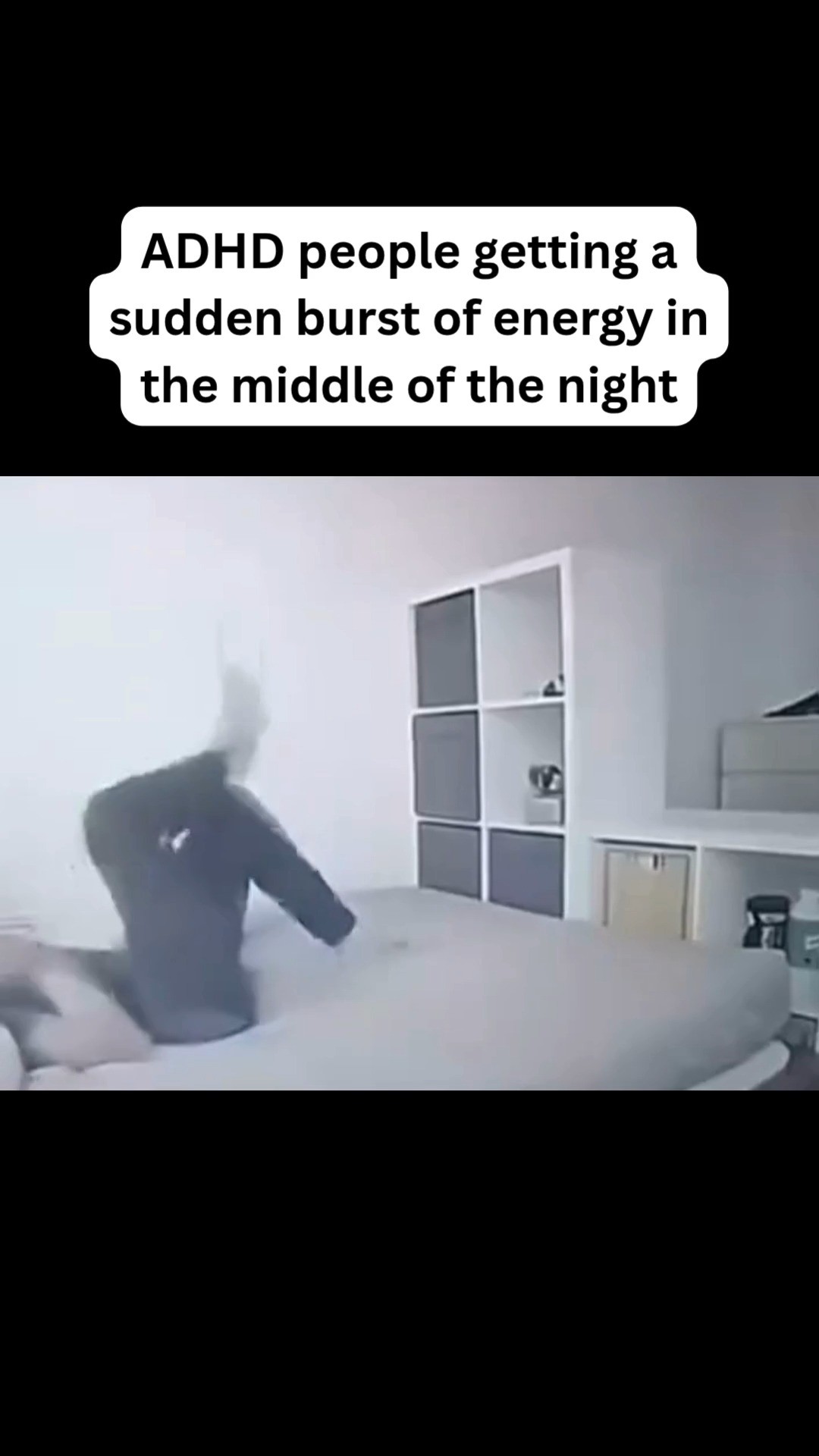 The cover image shows a person in a dark room, captured from a low camera angle. The person is positioned on a bed, captured in motion during a sudden, energetic movement. A text overlay saying "ADHD people getting a sudden burst of energy in the middle of the night" is in a white rounded rectangle with black borders, above the person. Behind the bed is a wall with a white built-in storage unit. The overall tone is casual and relatable, with the focus on the energetic movement.