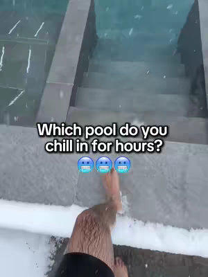 The image shows a first-person perspective of a snowy outdoor scene. There's a set of gray stone steps leading down into a turquoise pool of water. Snow is visible on the edges of the steps and the surrounding area. A leg and foot are visible at the bottom of the image showing a person stepping into the scene. Text overlayed on the image has the question
