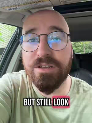 A man with glasses is sitting in a car, looking toward the camera with the hook text at the bottom that says "BUT STILL LOOK".