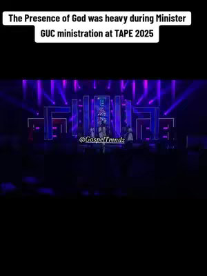 The image shows a dark stage setup with purple and blue lighting. In the foreground, several figures are on stage, likely performers or speakers. The text overlay reads "The Presence of God was heavy during Minister GUC ministration at TAPE 2025."