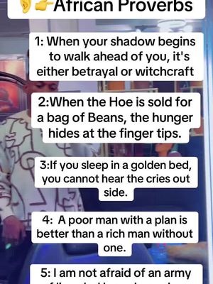 The cover image displays a list of African Proverbs in a vertical format. The background is blurred, suggesting an indoor setting and a person standing there. The text is white and presented on a white background, organized into numbered points. The color scheme is clean.