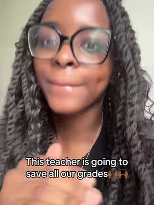 A close-up shot of a Black woman with braided hair and glasses. Text overlayed on the bottom of the image.