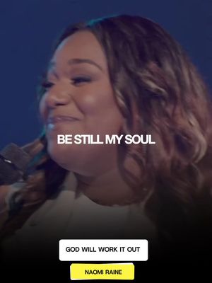 A woman with long brown hair smiles with text overlay of 'BE STILL MY SOUL' against a blurred background. Boxes at bottom say 'GOD WILL WORK IT OUT' and 'NAOMI RAINE'.