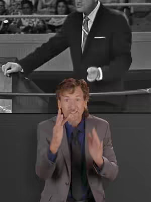 The cover image shows a man in a suit signing. Behind him there is a black and white image of a man in a suit speaking.