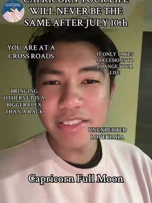 A selfie-style video cover image featuring a man centered in the frame with text overlays surrounding him. The background appears to be a light-colored wall. The man has short, dark hair and a slightly smiling expression. The text is a mix of information relating to the Capricorn full moon, along with other inspirational phrases.