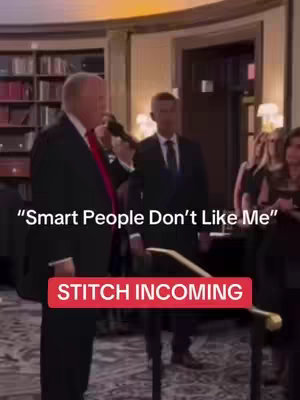 A man in a suit is speaking into a microphone. Text overlays read "Smart People Don't Like Me" and "STITCH INCOMING". The background is a room with bookshelves and other people.