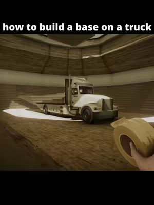 A composite image showing a truck inside a building for a game demo, the main subject is the truck, which is white with a camouflage paint job. The background is a light brown, and the foreground shows a hand holding a roll of tape.