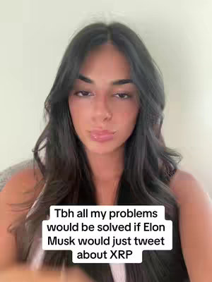A woman with dark hair and a neutral expression is centered in the frame. Text overlayed on the bottom part of the image. The background is a plain, light-colored wall.