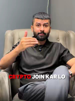 A man in a black shirt with a beard sitting in a chair with a grey background, and the text "CRYPTO JOIN KAR LO" over the bottom of the image.