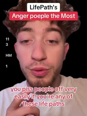 A selfie-style video cover shows a young man's face, centered on his chest. He has short, dark curly hair and is looking directly at the camera with his lips slightly parted. Above him, a white rectangular text box reads 'LifePath's' in a clear sans-serif font, followed by 'Anger poeple the Most' in a bold red color. Below his face, there is a smaller, white-colored text, and the text reads 'you piss people off very easily if you're any of these life paths.' The background is completely black, emphasizing the subject. 