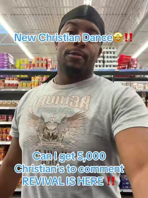 A man wearing a grey t-shirt with a graphic on it stands in a store with products on shelves in the background. Text overlays appear on the image.