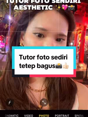 The cover image features a woman capturing a selfie, with the framing guided by an iPhone photo interface. A text box overlays her face, and the background consists of a blurred outdoor setting, likely taken at night, with red lights suggesting a restaurant or bar.
