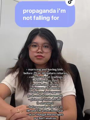 The image features a young woman with glasses, centered in the frame. Above her head, a rounded rectangle contains text. Below, a list of bullet points detailing certain astrology themed themes that the creator is not falling for. The overall composition is a selfie style shot.