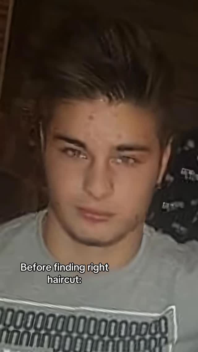 The image shows a young man with a slightly angled, medium shot. He is looking at the camera, against a darker background that suggests an indoor setting. Text overlayed on the bottom