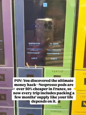 The image shows a person's reflection in a glass panel displaying Nespresso product prices in a store. Below the panel, the background is composed of colorful boxes of Nespresso pods. A white text overlay provides context about the product.