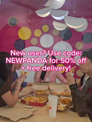 A group of people are sitting around a table eating pizza while a text overlay providing a discount code appears above the people in the image.