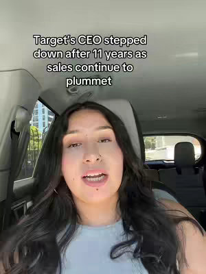 A woman filming herself from the front seat of a car. On the top is a text overlay stating "Target's CEO stepped down after 11 years as sales continue to plummet".