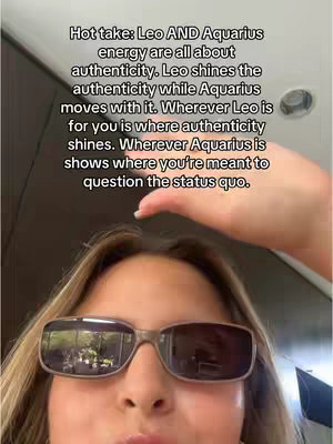A selfie-style cover image featuring a young woman wearing sunglasses. The sunglasses' lenses reflect a blurry outdoor scene. Above her, a hand reaches up, and text overlays describe astrological concepts, set against a neutral background.