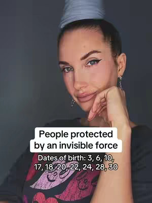A selfie-style image featuring a woman with light makeup, dark eyeliner, and a silver-colored object on her head. She is looking at the camera. A white rectangle with text is overlaid on the lower-center of the image, and dates of birth are listed.