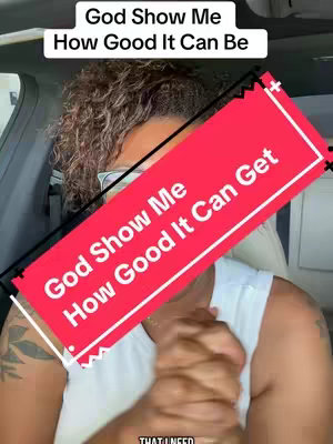 An image featuring a woman sitting in what appears to be a car, with overlaid text in a red rectangular shape and rectangular text box at the top. The woman has her hands clasped in prayer. The style of the image is a direct, selfie-style shot.