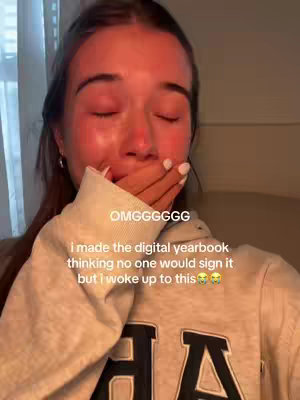 A close up shot of a young woman with damp cheeks and red eyes, indicating crying. Her hand is covering her mouth. Overlayed text in white at the top, and a sweatshirt with “AA” on it completes the picture.