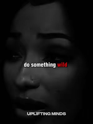 A grayscale image of a person's face, with the focus on the lower part of their eyes and the mouth. The face is shadowed, adding depth. Text overlayed reads 'do something wild' in a white sans-serif font with the word 'wild' in red. The text 'UPLIFTING MINDS' in white font is visible below.